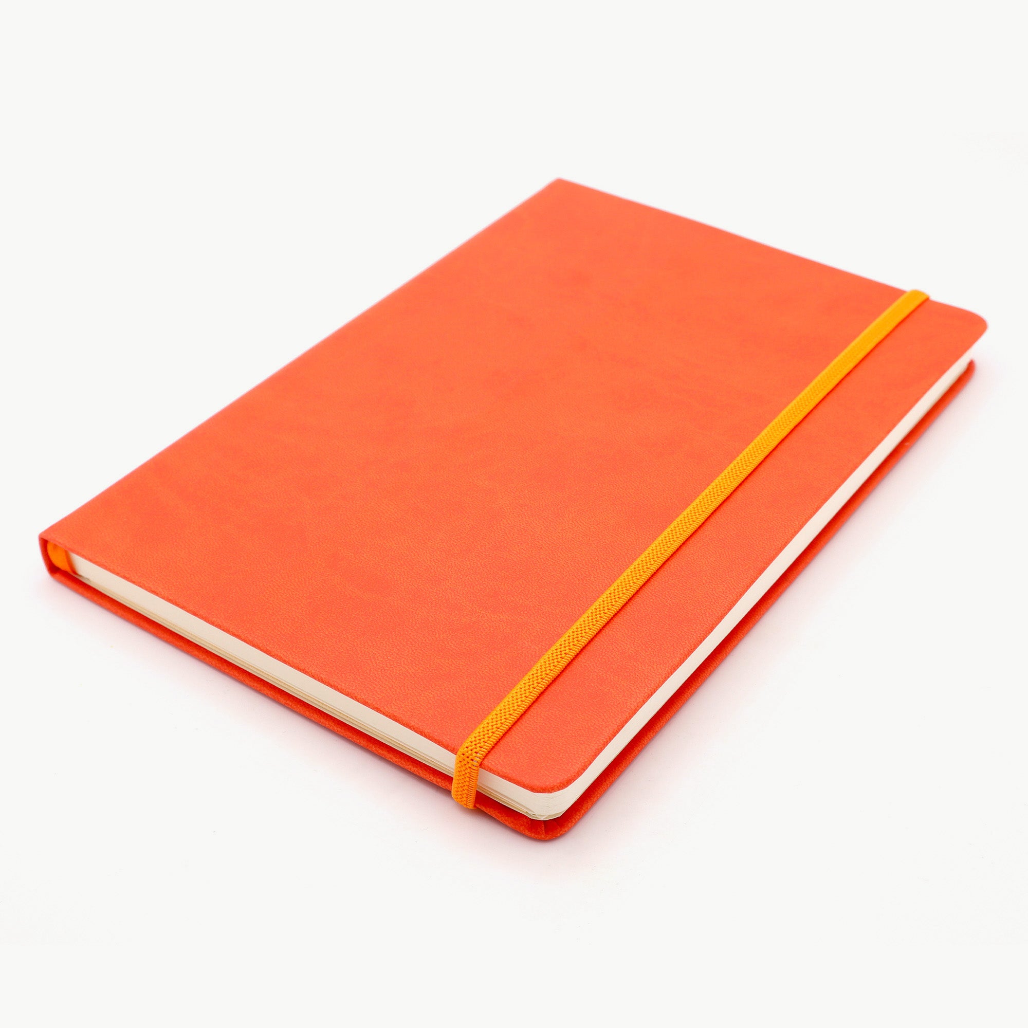 Orange notebook with a yellow elastic band on a white background